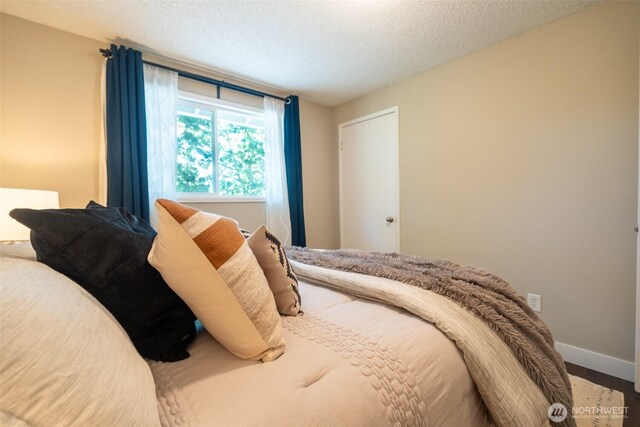 1638 Index Ave SE, Renton, WA 98058 - bedroom with baseboards and a textured ceiling