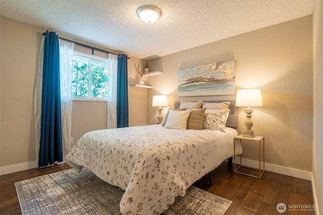 1638 Index Ave SE, Renton, WA 98058 - bedroom featuring a textured ceiling and dark wood-style flooring