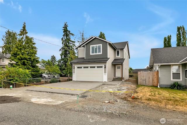 608B Deeded Ln SW, Orting, WA 98360 - traditional-style home with an attached garage and driveway