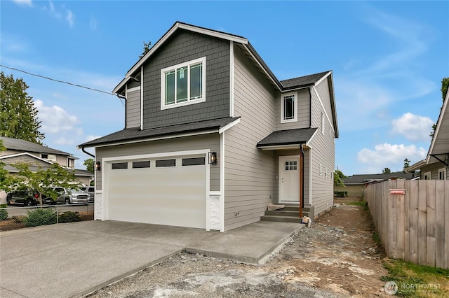 608B Deeded Ln SW, Orting, WA 98360 - view of front of house featuring a garage and concrete driveway