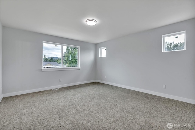 608B Deeded Ln SW, Orting, WA 98360 - empty room with baseboards and carpet
