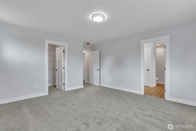 608B Deeded Ln SW, Orting, WA 98360 - unfurnished bedroom with carpet floors, a walk in closet, and ensuite bath