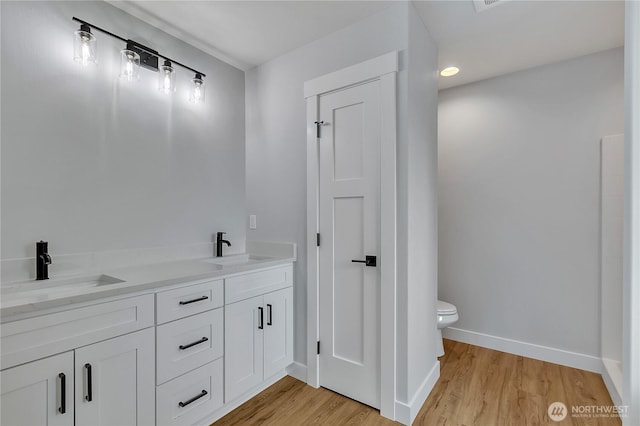 608B Deeded Ln SW, Orting, WA 98360 - bathroom with wood finished floors and double vanity