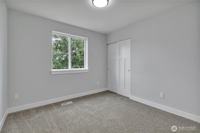 608B Deeded Ln SW, Orting, WA 98360 - unfurnished bedroom featuring carpet flooring and a closet
