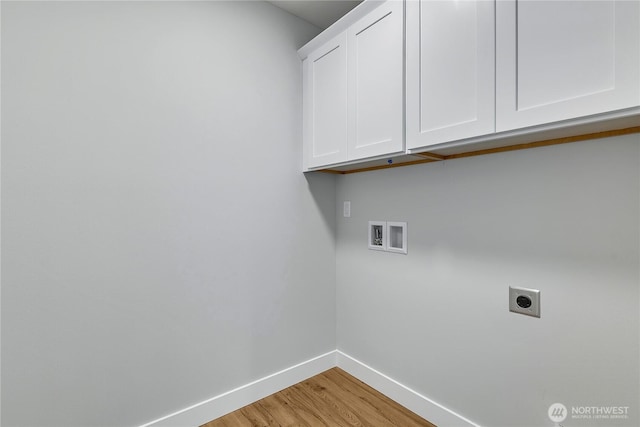 608B Deeded Ln SW, Orting, WA 98360 - laundry area with hookup for an electric dryer, cabinet space, washer hookup, and light wood-style floors