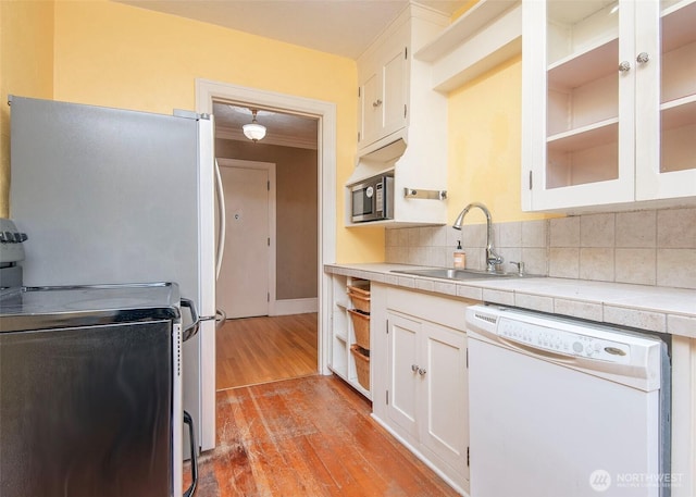 720 6th Ave Unit 206, Tacoma, WA 98405 - kitchen with white dishwasher, range, tile counters, and white cabinetry