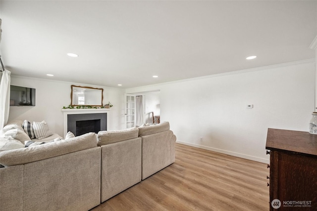 17371 Dunbar Rd, Mount Vernon, WA 98273 - living area featuring a fireplace, crown molding, light wood finished floors, and recessed lighting
