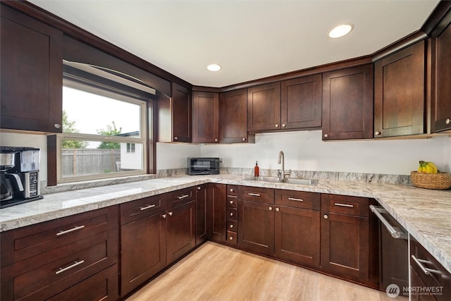 17371 Dunbar Rd, Mount Vernon, WA 98273 - kitchen featuring stainless steel dishwasher, light wood-style floors, black microwave, dark brown cabinets, and recessed lighting