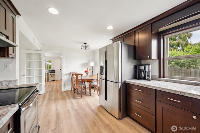 17371 Dunbar Rd, Mount Vernon, WA 98273 - kitchen with stainless steel appliances, light wood-style floors, dark brown cabinets, and recessed lighting