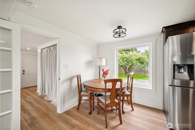 17371 Dunbar Rd, Mount Vernon, WA 98273 - dining space with ornamental molding and light wood-style flooring