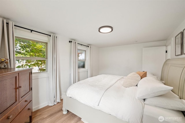 17371 Dunbar Rd, Mount Vernon, WA 98273 - bedroom with light wood-style flooring and multiple windows