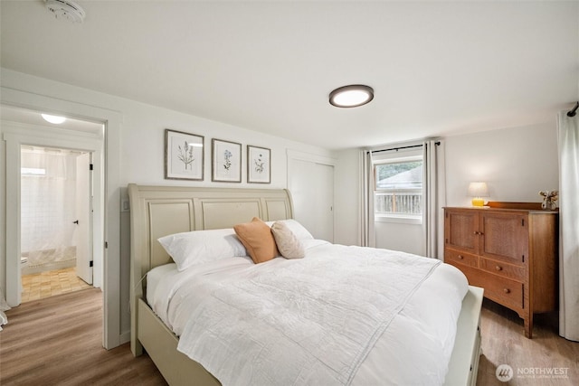 17371 Dunbar Rd, Mount Vernon, WA 98273 - bedroom with light wood finished floors and ensuite bathroom
