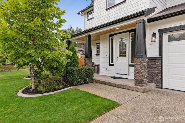 4921 Skylark St NE, Lacey, WA 98516 - view of exterior entry featuring a garage, a lawn, stone siding, and a porch