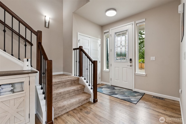 4921 Skylark St NE, Lacey, WA 98516 - foyer featuring healthy amount of natural light, hardwood / wood-style floors, and stairway