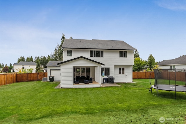 4921 Skylark St NE, Lacey, WA 98516 - back of property with a trampoline, a fenced backyard, a patio area, and outdoor lounge area