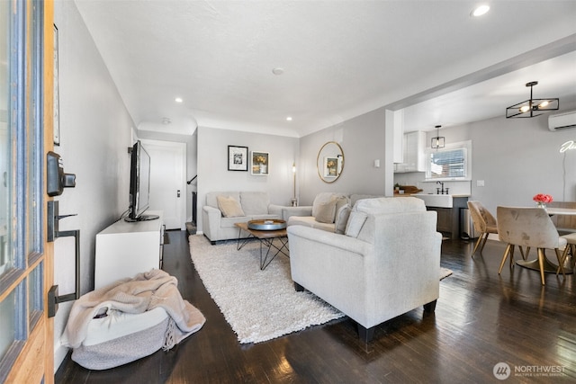 709 7th St SW, Puyallup, WA 98371 - living area with dark wood-style floors, a wall mounted AC, and recessed lighting