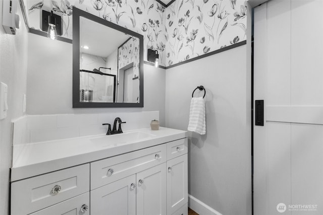 709 7th St SW, Puyallup, WA 98371 - bathroom featuring vanity, a shower, and wallpapered walls