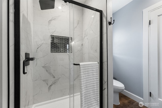 709 7th St SW, Puyallup, WA 98371 - bathroom featuring a marble finish shower and wood finished floors