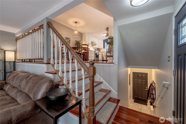 916 N 165th St Unit 7, Shoreline, WA 98133 - stairway with baseboards and tile patterned floors