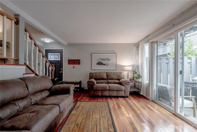 916 N 165th St Unit 7, Shoreline, WA 98133 - living room with light wood-style flooring, stairway, and cooling unit