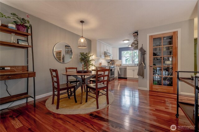 916 N 165th St Unit 7, Shoreline, WA 98133 - dining area featuring dark wood finished floors