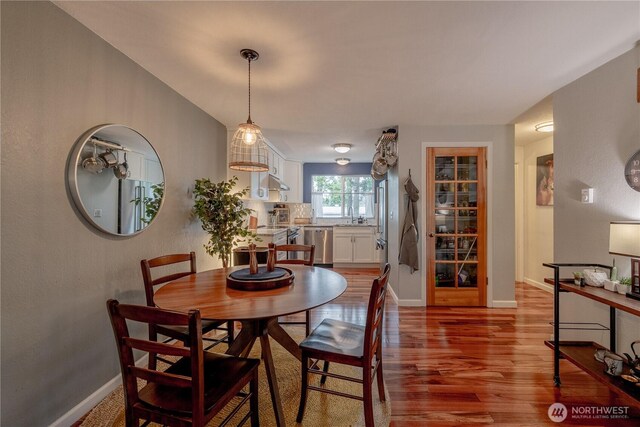916 N 165th St Unit 7, Shoreline, WA 98133 - dining room with wood finished floors and baseboards