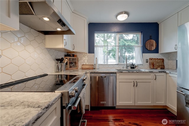 916 N 165th St Unit 7, Shoreline, WA 98133 - kitchen featuring appliances with stainless steel finishes, extractor fan, dark wood finished floors, and white cabinets