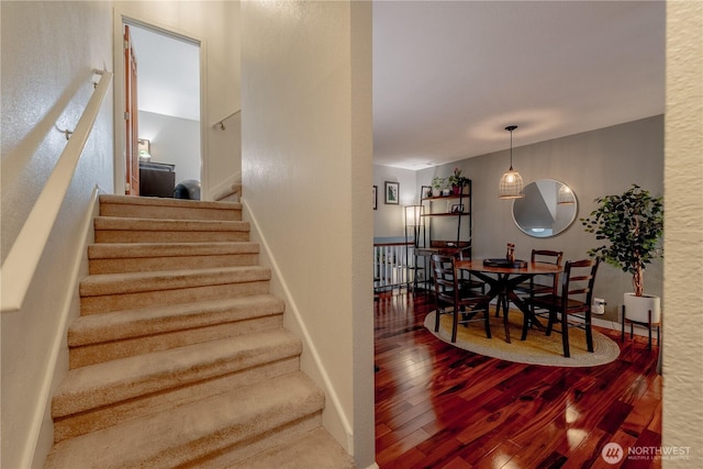 916 N 165th St Unit 7, Shoreline, WA 98133 - staircase with hardwood / wood-style floors and baseboards