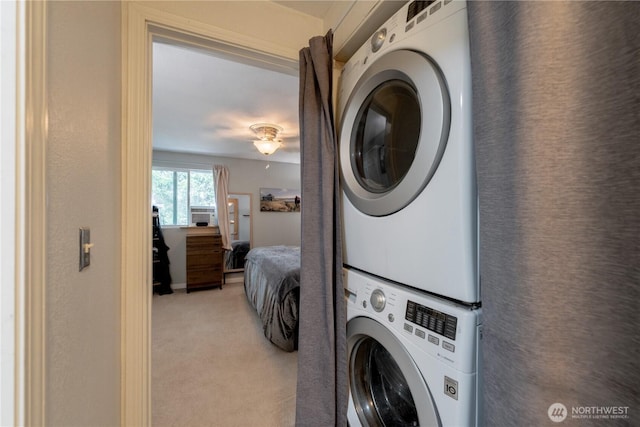 916 N 165th St Unit 7, Shoreline, WA 98133 - laundry room with estacked washer and dryer and light colored carpet
