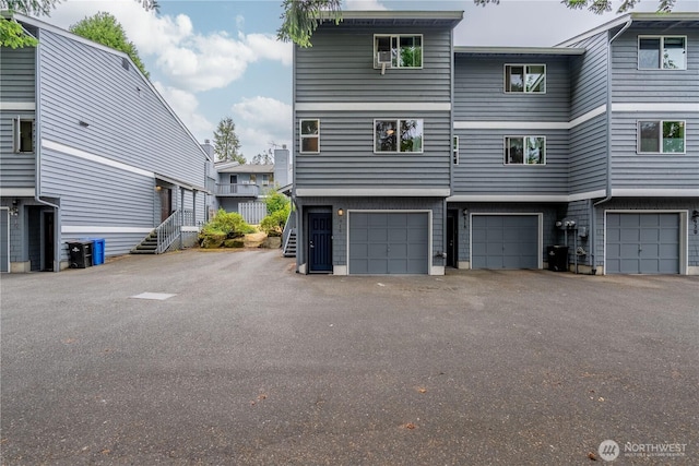 916 N 165th St Unit 7, Shoreline, WA 98133 - back of property featuring an attached garage and driveway