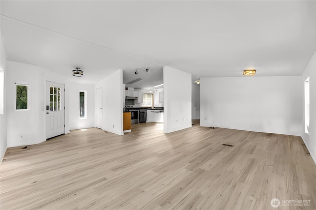 241B Foster Creek Rd, Toledo, WA 98591 - unfurnished living room with light wood-style flooring and baseboards