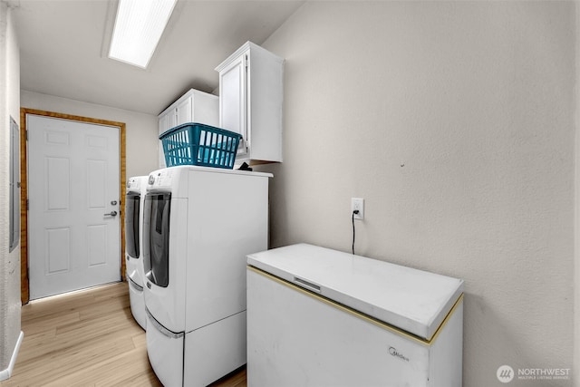 241B Foster Creek Rd, Toledo, WA 98591 - laundry area with washer and dryer, cabinet space, and light wood-style floors