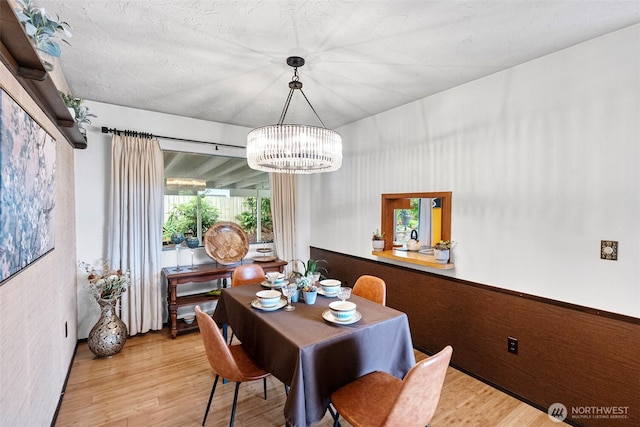 152 E Park Ln, Port Angeles, WA 98362 - dining space with wood finished floors and a chandelier