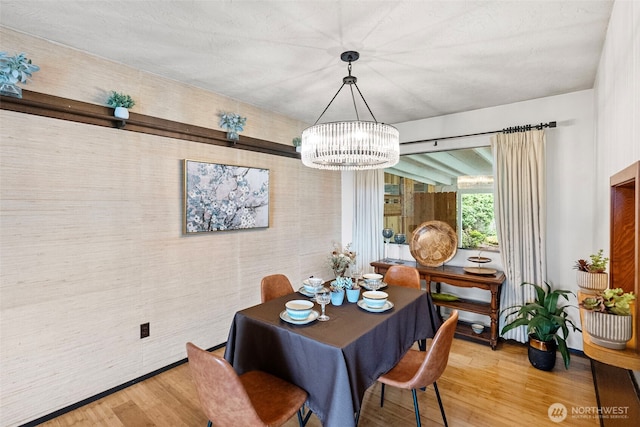 152 E Park Ln, Port Angeles, WA 98362 - dining space with light wood-style floors and a chandelier