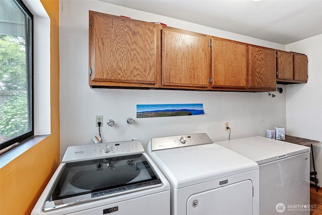 152 E Park Ln, Port Angeles, WA 98362 - washroom with cabinet space, washer and clothes dryer, and wood finished floors
