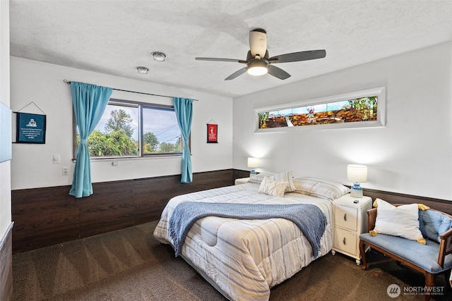 152 E Park Ln, Port Angeles, WA 98362 - bedroom with multiple windows, carpet floors, a textured ceiling, and a ceiling fan