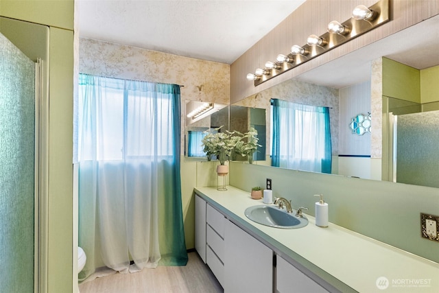 152 E Park Ln, Port Angeles, WA 98362 - full bathroom with a shower, vanity, and wood finished floors