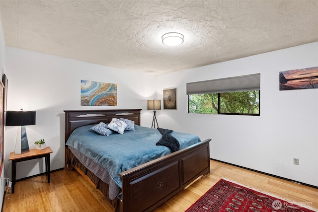 152 E Park Ln, Port Angeles, WA 98362 - bedroom featuring light wood-style flooring and a textured ceiling