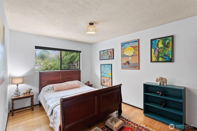 152 E Park Ln, Port Angeles, WA 98362 - bedroom with light wood-type flooring and a textured ceiling