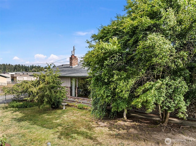 152 E Park Ln, Port Angeles, WA 98362 - view of front of house featuring a chimney, a shingled roof, and brick siding