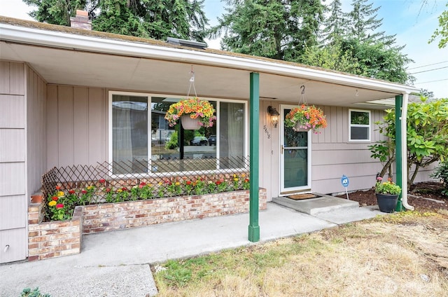 8618 94th St SW, Lakewood, WA 98498 - doorway to property with a porch and a chimney