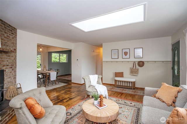 8618 94th St SW, Lakewood, WA 98498 - living area featuring wood finished floors and wainscoting