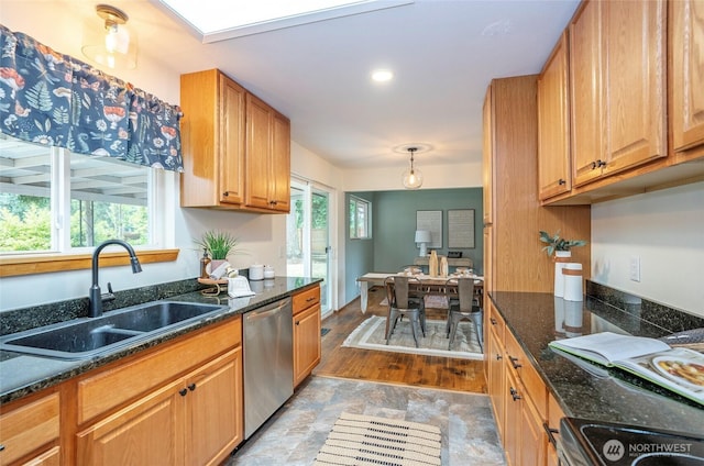 8618 94th St SW, Lakewood, WA 98498 - kitchen featuring stainless steel dishwasher, range with electric stovetop, dark stone countertops, and light stone finish flooring