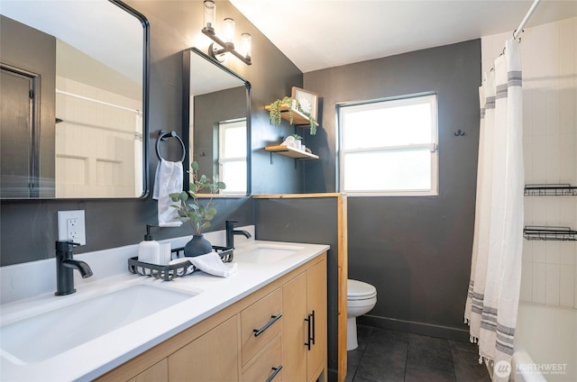 8618 94th St SW, Lakewood, WA 98498 - bathroom with double vanity, tile patterned flooring, healthy amount of natural light, and shower / bath combination with curtain