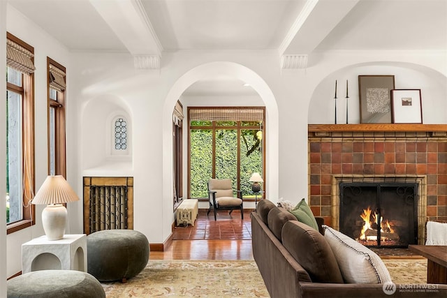 3103 Mount Rainier Dr S, Seattle, WA 98144 - living room featuring wood finished floors, a tile fireplace, crown molding, and beamed ceiling