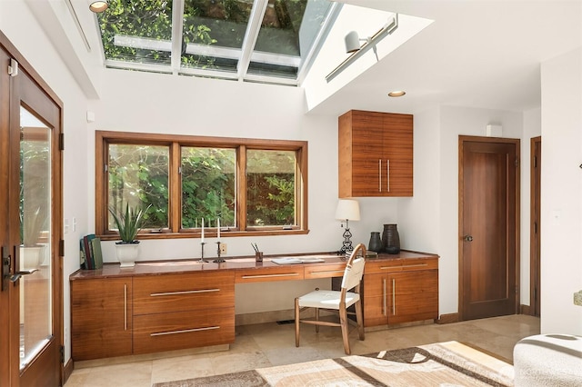 3103 Mount Rainier Dr S, Seattle, WA 98144 - kitchen with brown cabinetry, modern cabinets, a skylight, and recessed lighting