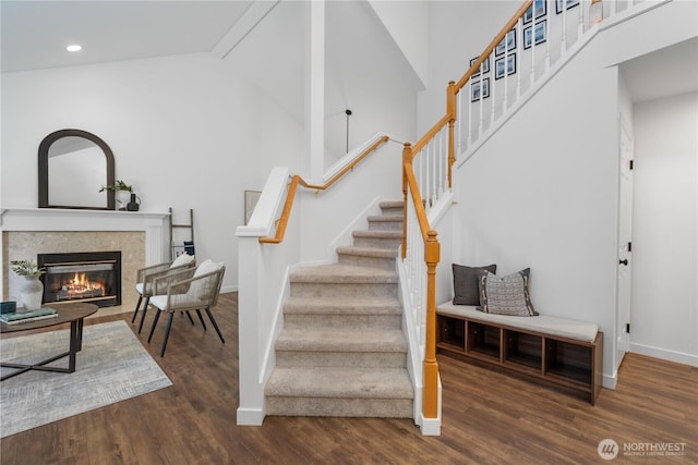9220 NE 195th St, Bothell, WA 98011 - stairs with recessed lighting, wood finished floors, a glass covered fireplace, and lofted ceiling