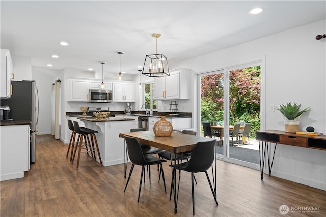 9220 NE 195th St, Bothell, WA 98011 - dining area featuring wood finished floors, recessed lighting, and a chandelier