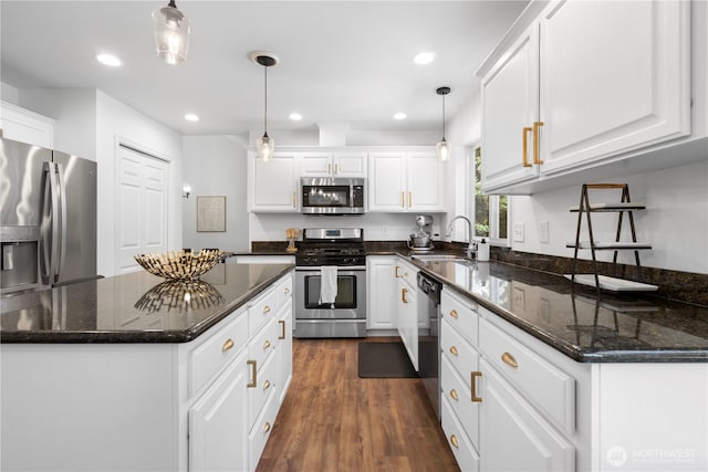 9220 NE 195th St, Bothell, WA 98011 - kitchen with stainless steel appliances, white cabinets, dark wood-style floors, pendant lighting, and recessed lighting
