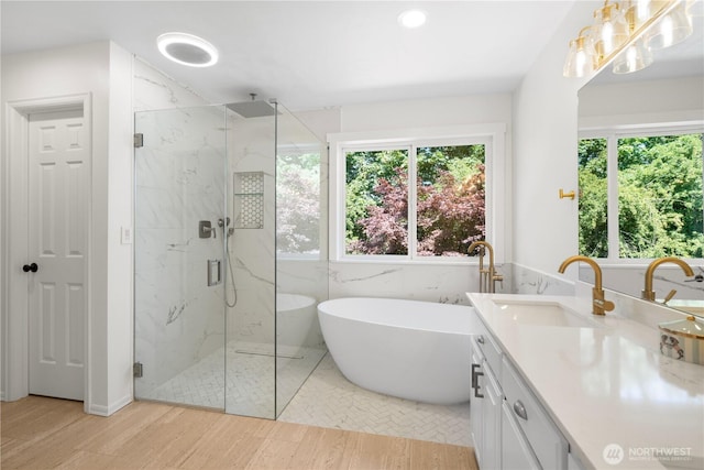 9220 NE 195th St, Bothell, WA 98011 - full bathroom featuring a marble finish shower, plenty of natural light, a freestanding bath, and recessed lighting